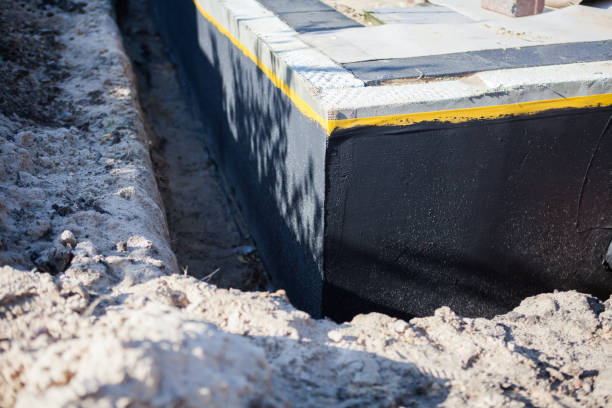 Professional Waterproofing technician working in Bayville, NJ
